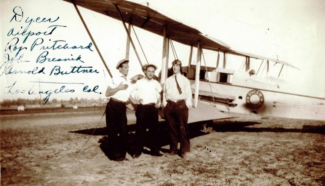 Roy Pritchard, John Bresnik and Harold Buttner beside a Dycer biplane, Los Angeles